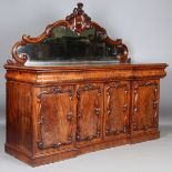 A mid-Victorian mahogany mirror-back sideboard, the four cupboard doors enclosing drawers, height