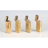 A group of four Dunhill gilt metal pocket gas lighters of various designs (some wear).Buyer’s