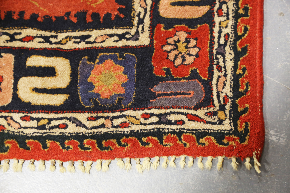 A Persian style rug, 20th century, the deep terracotta field with a column of palmettes, within a - Image 3 of 12