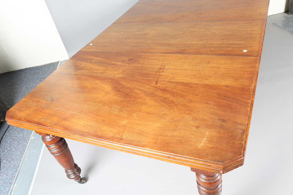 An Edwardian walnut extending dining table with two extra leaves, height 72cm, extended length - Image 5 of 8