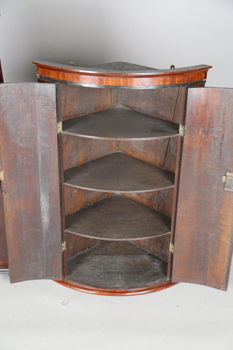 A George III oak hanging bowfront corner cabinet with mahogany crossbanded doors, height 101cm, - Image 3 of 4