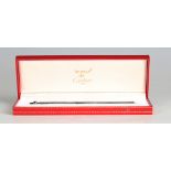 A Must de Cartier silvered ballpoint pen, with original case.Buyer’s Premium 29.4% (including