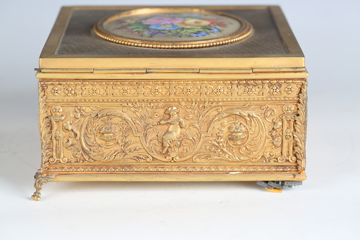 An early 20th century French gilt metal jewellery casket, the top inset with a floral painted - Image 5 of 9