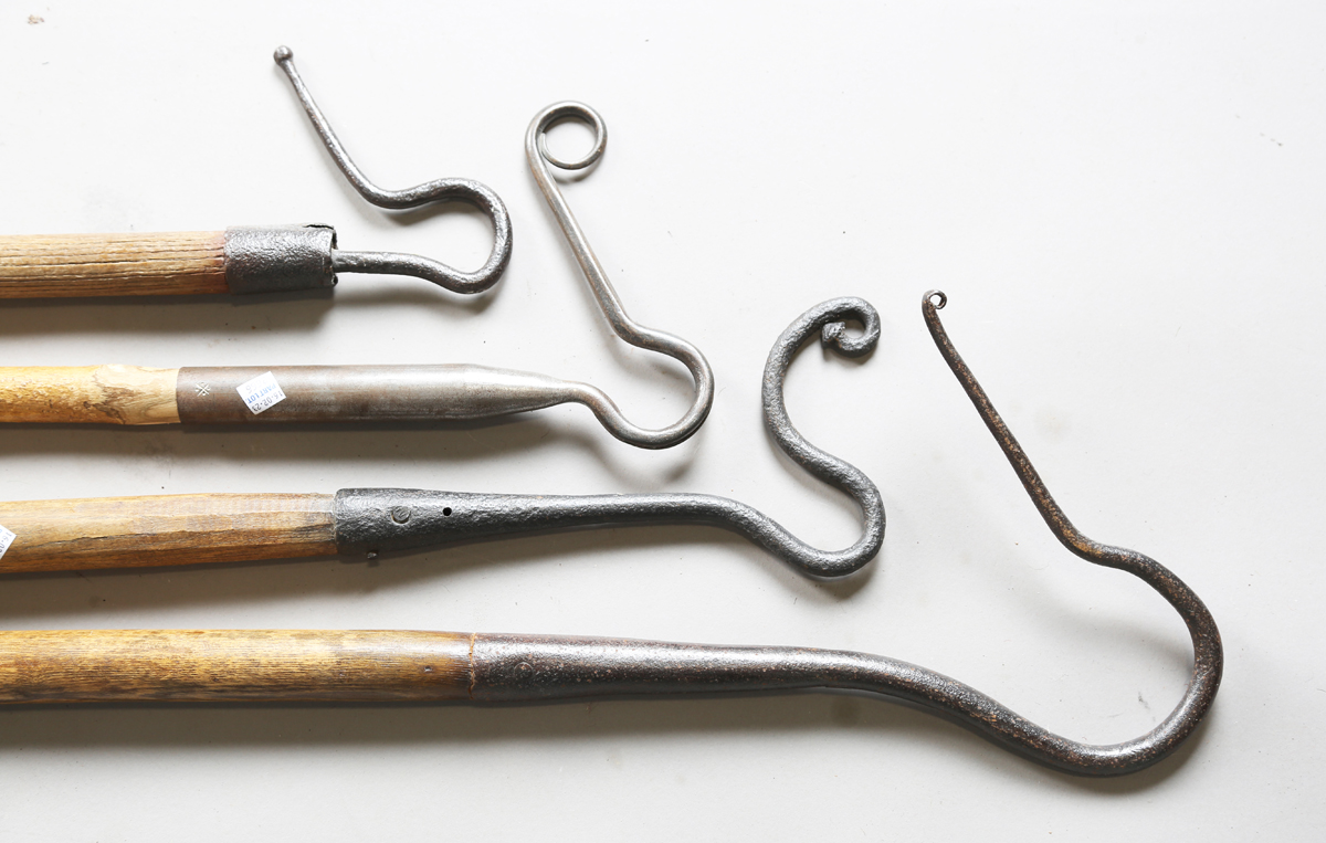 A group of four 19th century and later shepherds' crooks, one with very large wrought hook and ash