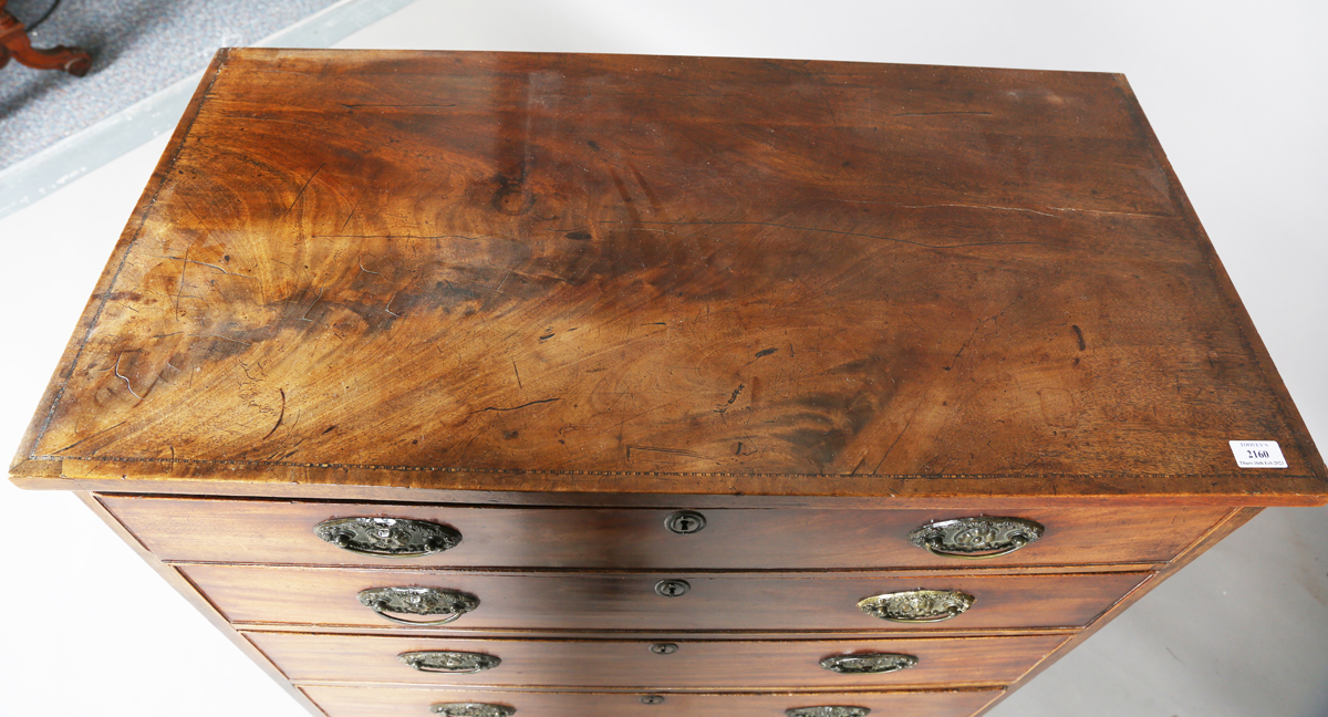 A George III mahogany chest of four graduated long drawers, fitted with oval embossed brass - Image 8 of 8