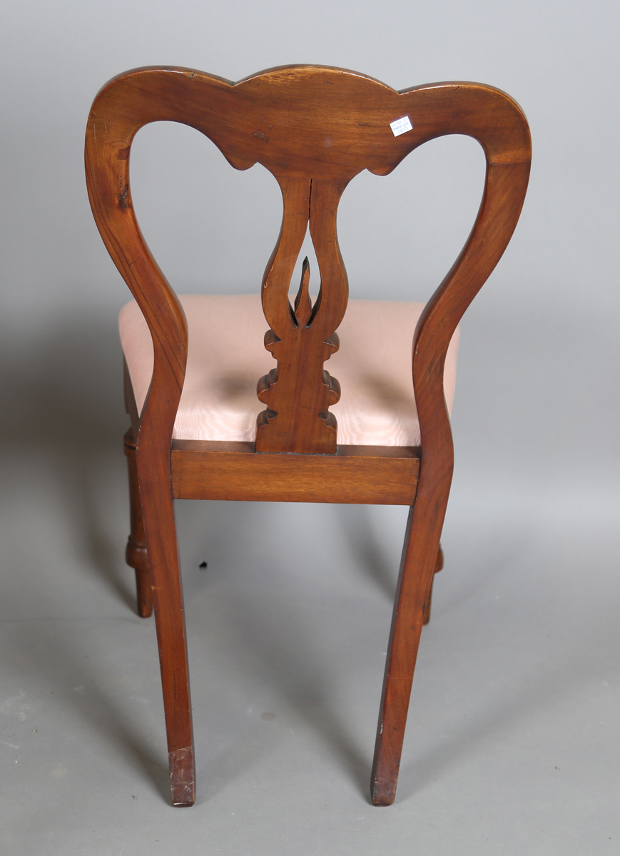 A set of four Victorian mahogany dining chairs, the shaped backs above upholstered drop-in seats, on - Image 5 of 9
