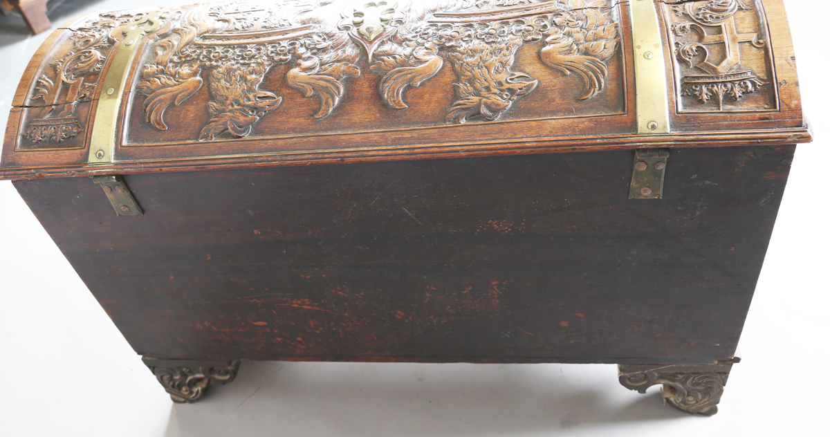 An 18th century French walnut domed trunk, finely carved with coats of arms, initials and further - Image 3 of 14