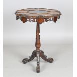 A late Victorian walnut circular 'Lazy Susan' table, the top with eight circular recesses, on a