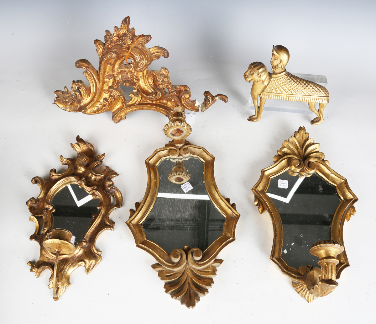 A pair of 20th century giltwood girandole wall mirrors, height 34cm, together with a group of