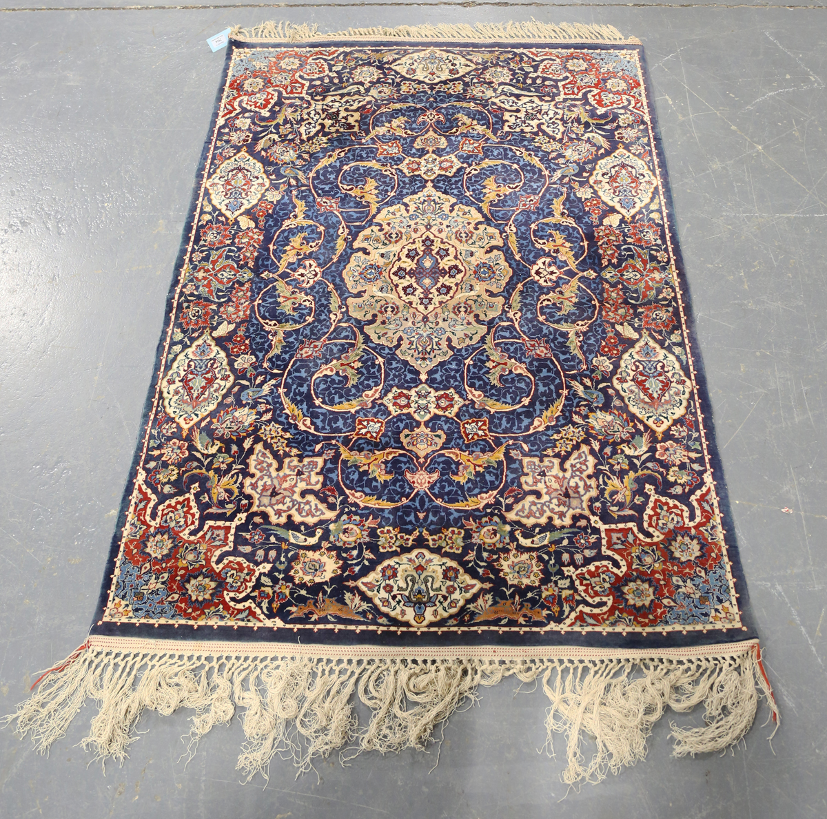 An Esfahan rug, Central Persia, late 20th century, the blue field with a shaped medallion, within