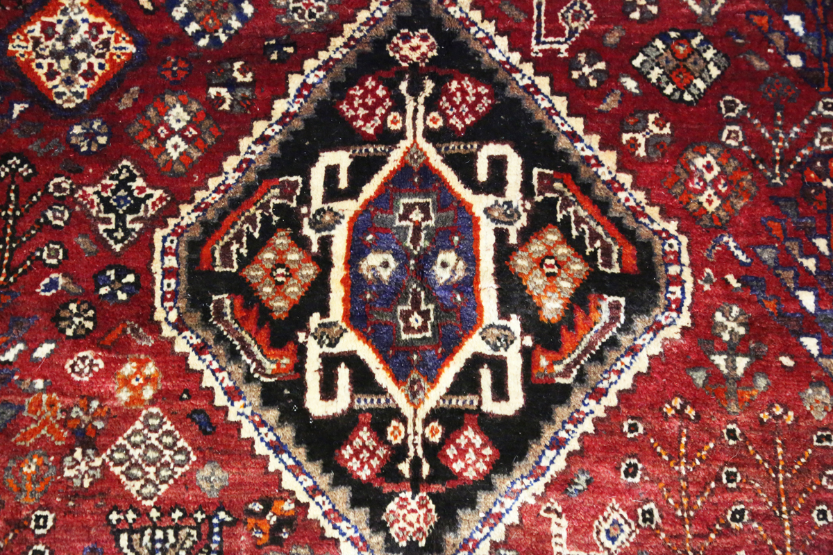 A Ghashghai rug, South-west Persia, late 20th century, the red field with three linked medallions, - Image 8 of 8