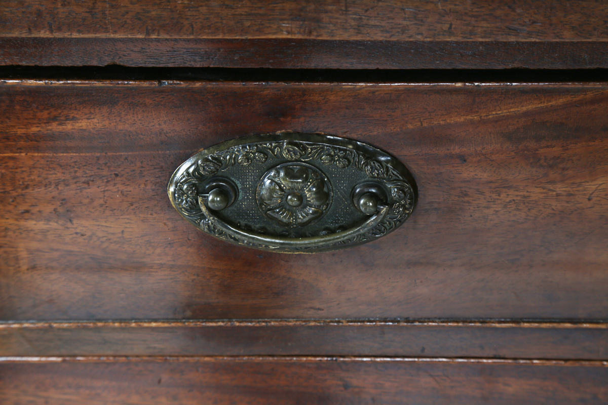 A George III mahogany chest of four graduated long drawers, fitted with oval embossed brass - Image 5 of 8