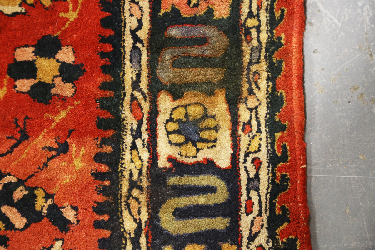 A Persian style rug, 20th century, the deep terracotta field with a column of palmettes, within a - Image 4 of 12