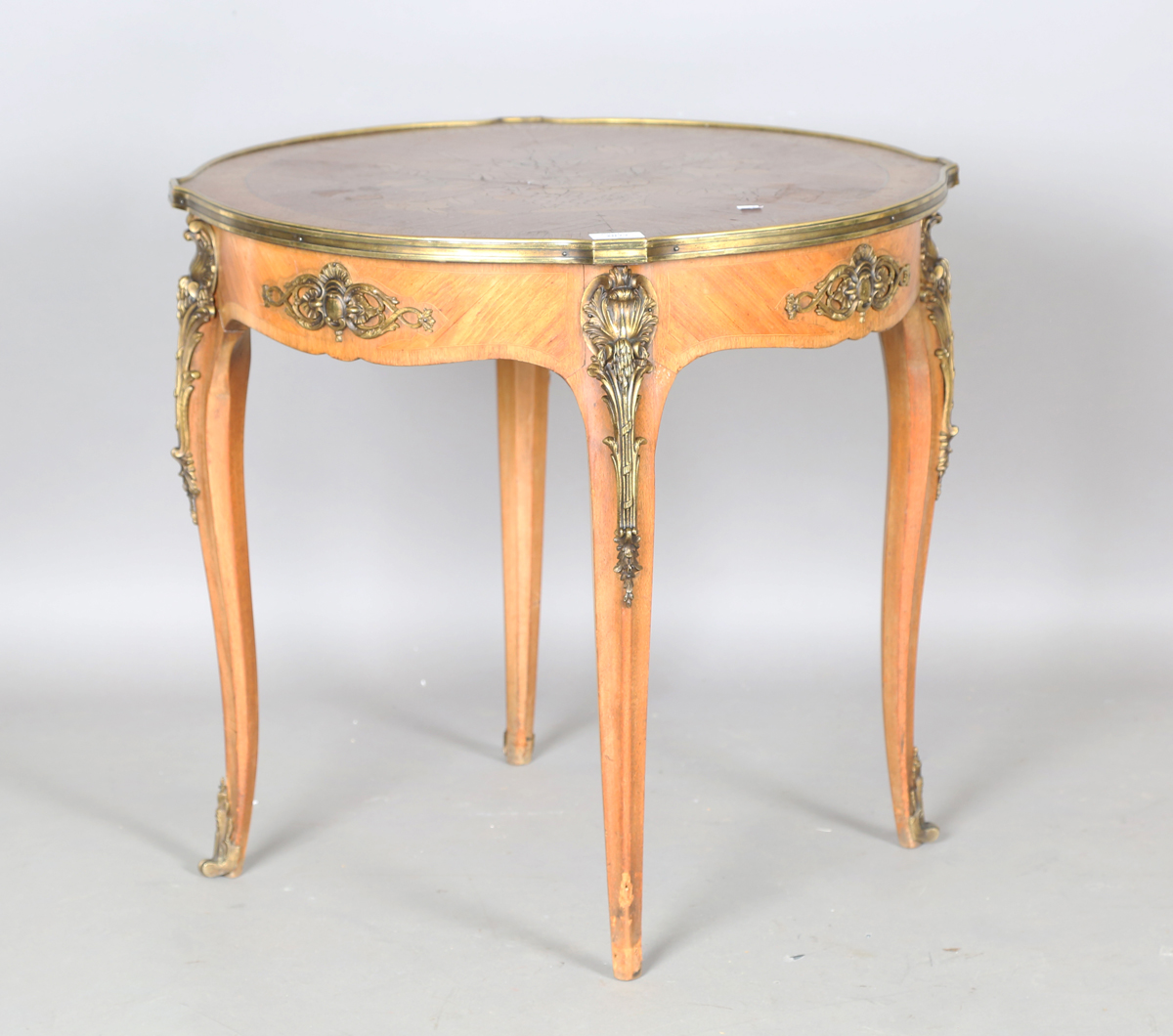 An early 20th century French kingwood and gilt metal mounted circular occasional table, the top