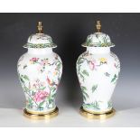 A pair of late 20th century French porcelain table lamps, decorated in the Chinese style, the