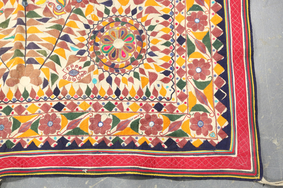 An Indian kutch needlework hanging, embroidered in polychrome threads and embellished with - Image 3 of 8