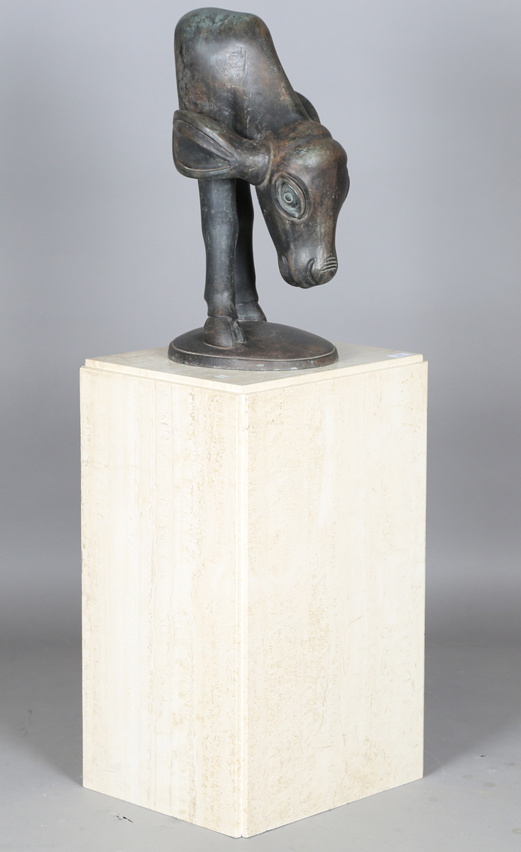 South African School - a late 20th century patinated bronze model of a young cow drinking water,