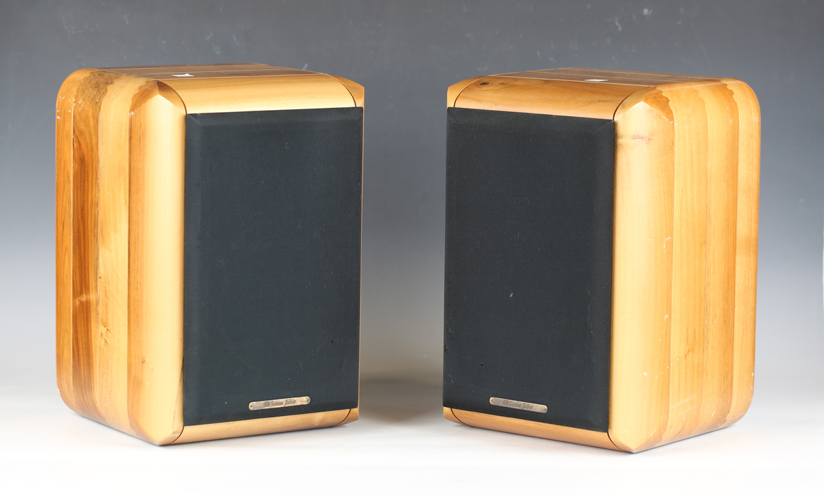 A pair of Italian Sonus Faber Electa speakers within shaped wooden casings, height 37cm, width 26cm.