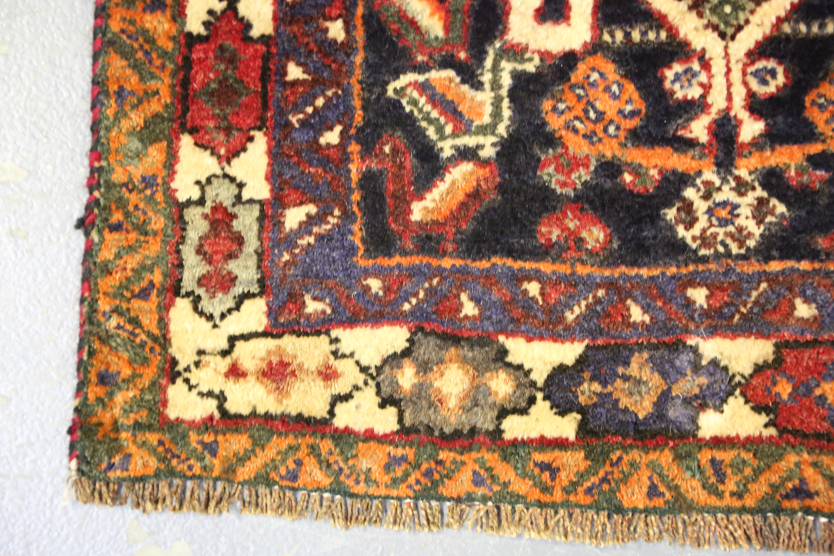 A Ghashghai rug, South-west Persia, late 20th century, the red field with three linked medallions, - Image 4 of 8