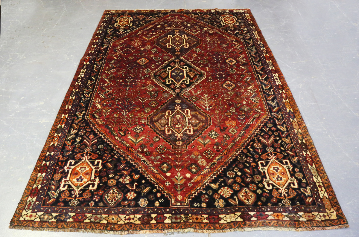 A Ghashghai rug, South-west Persia, late 20th century, the red field with three linked medallions,