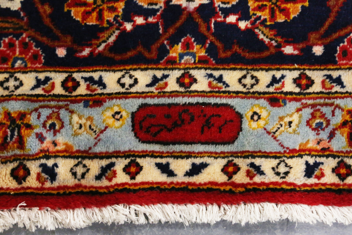 A Kashan carpet, Central Persia, modern, the red field with a shaped medallion, within a blue - Image 3 of 9