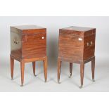 A pair of George III style mahogany wine coolers, each fitted with two brass swing handles, on