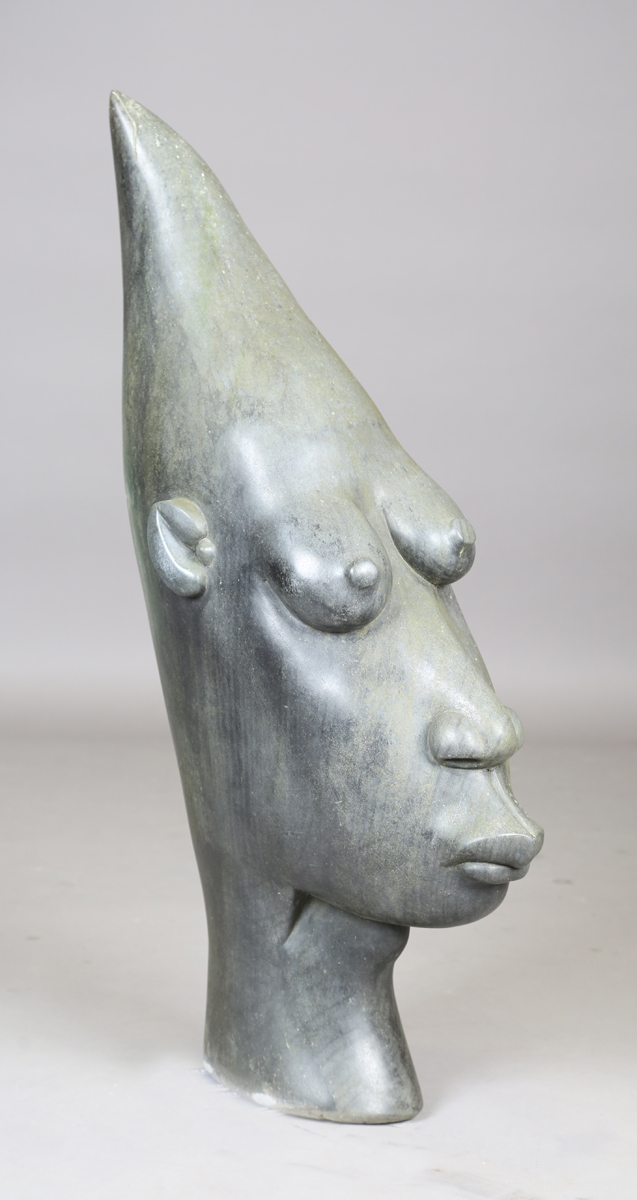 Bernard Matemera - a large late 20th century Shona carved dark green stone surrealist style head,