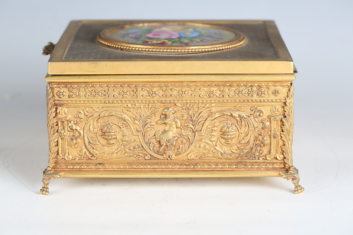 An early 20th century French gilt metal jewellery casket, the top inset with a floral painted - Image 6 of 9