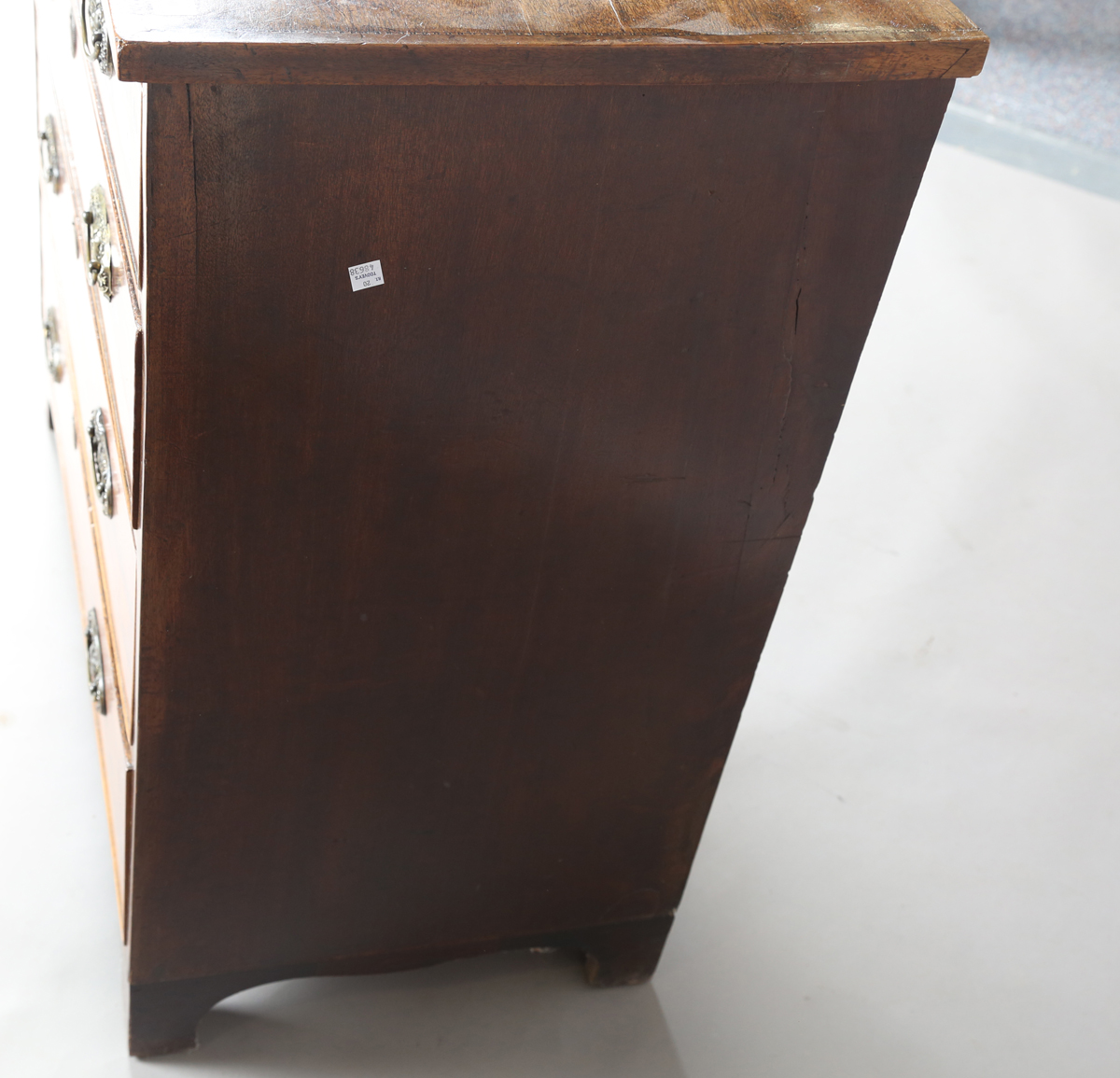 A George III mahogany chest of four graduated long drawers, fitted with oval embossed brass - Image 2 of 8