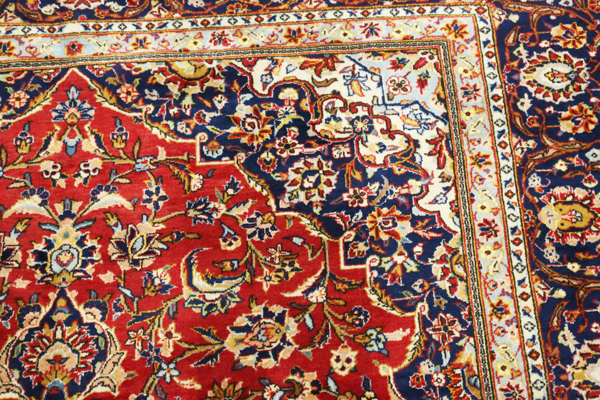 A Kashan carpet, Central Persia, modern, the red field with a shaped medallion, within a blue - Image 8 of 9