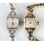 A Hamilton white gold and diamond set lady's dress wristwatch with signed square dial, the watch