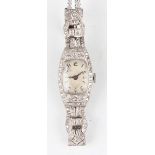 A Gelda platinum cased and diamond set lady's dress wristwatch with signed oval jewelled movement,