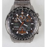 A Citizen Eco-Drive WR 200 titanium cased gentleman's bracelet wristwatch, the signed black dial