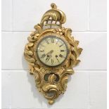 An early 20th century carved giltwood and gesso cartel style wall clock with Swiss eight day