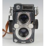 A Yashica-44 twin lens reflex camera, No. 3960491, with Yashinon 1:3.5 f=60mm lenses, with leather