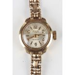 An Avia 9ct gold cased lady's bracelet wristwatch, the signed silvered dial with gilt Arabic and