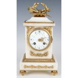 A late 19th century French gilt metal mounted white marble mantel clock with eight day movement