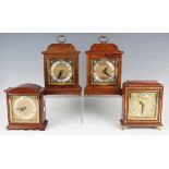 Two 20th century walnut mantel timepieces by F.W. Elliott & Co, each with square brass dial