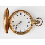 An 18ct gold cased keyless wind half-hunting cased lady's fob watch, the gilt three-quarter plate