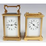 Two early 20th century French gilt brass carriage timepieces, each enamelled dial with black Roman