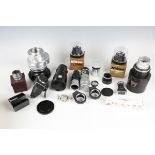A large collection of assorted camera accessories, including a Kodak Aero-Ektar f:2.5 7in 178mm