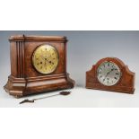 A late 19th century walnut cased mantel clock with eight day movement striking on a bell, the