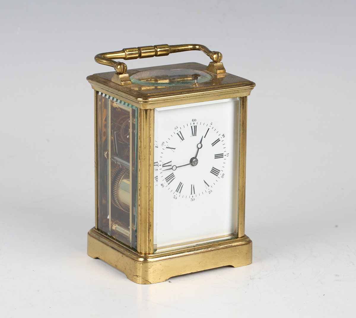 A late 19th century French lacquered brass cased carriage clock with eight day movement striking