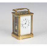 A late 19th century French lacquered brass cased carriage clock with eight day movement striking
