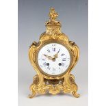 A late 19th century Louis XV style ormolu cased mantel clock with eight day movement striking on a