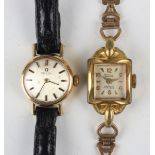 An Omega gilt metal fronted circular cased lady's wristwatch with signed jewelled movement, the