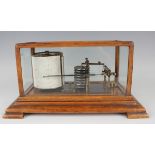 An early 20th century oak cased barograph with gilt brass mechanism and clockwork recording drum,