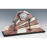 An Art Deco rouge marble, onyx, slate and spelter mantel clock with eight day movement striking on a