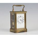 An early 20th century French brass cased carriage clock with eight day movement striking hours, half