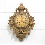 A mid-20th century giltwood and gesso cartel style wall clock with eight day movement striking on
